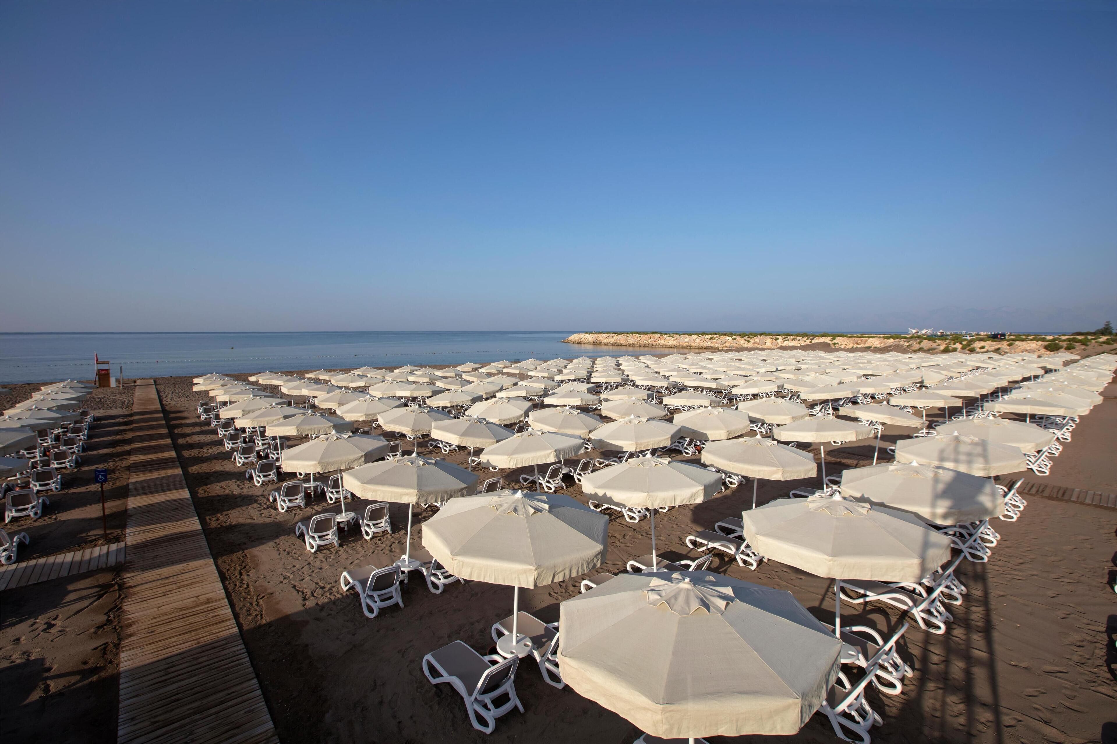 private beach nearby, free beach shuttle, sun-loungers, beach umbrellas