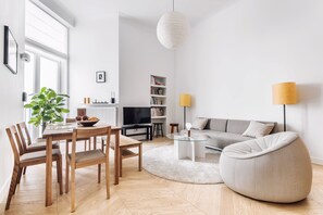 Apartment, 1 Bedroom (Street Pilsudskiego 11) | Living room | Flat-screen TV - EchoDom 3 Apartments (Kraków)
