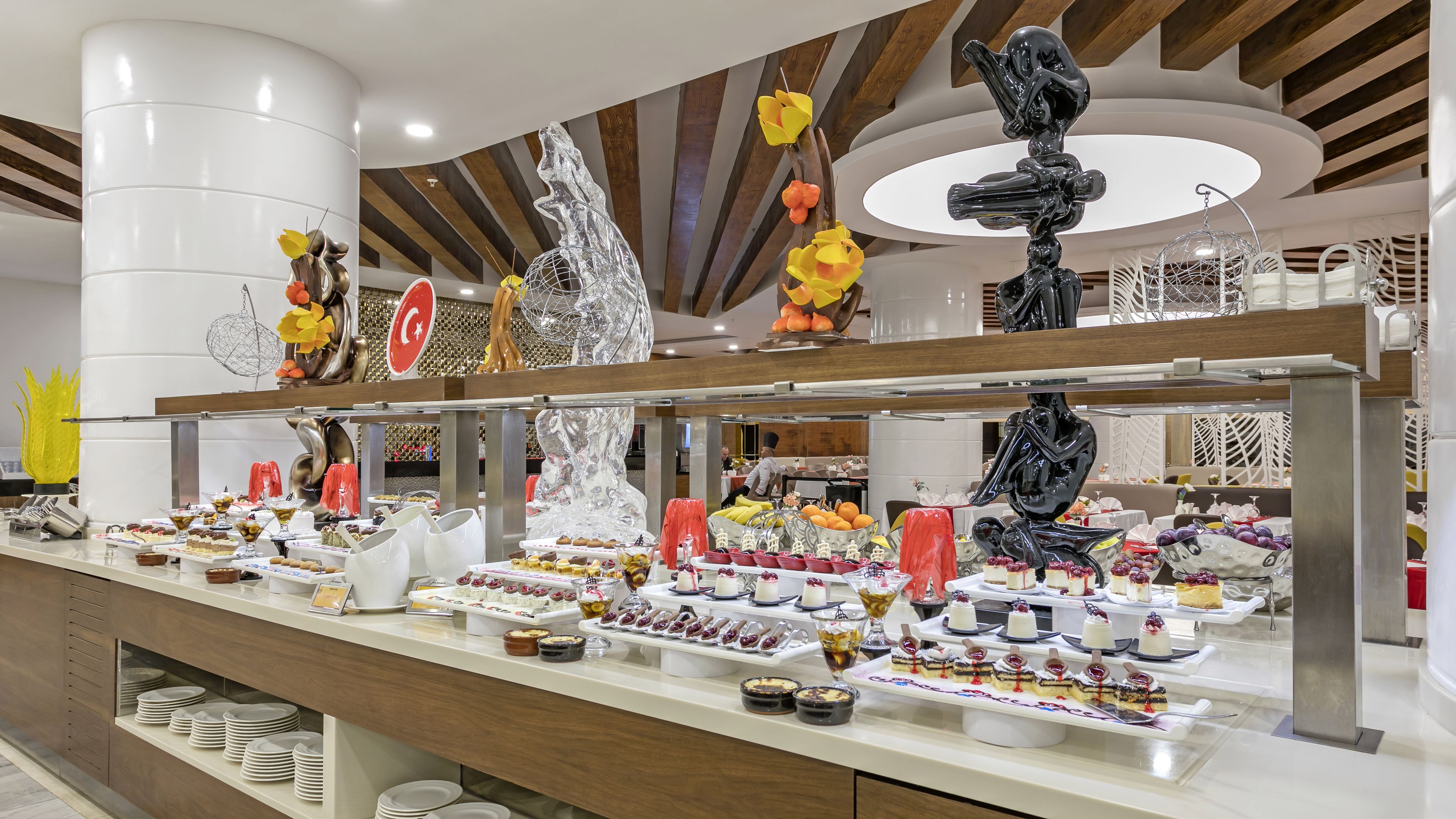 A buffet with various food items and decorative elements.