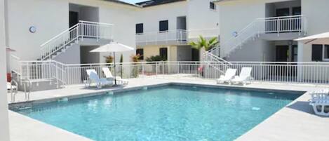 Classic Apartment, 2 Bedrooms | Pool | Seasonal outdoor pool, pool umbrellas, sun loungers