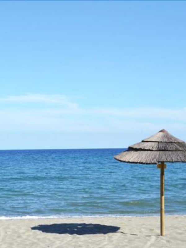 On the beach, sun loungers, beach umbrellas, beach towels