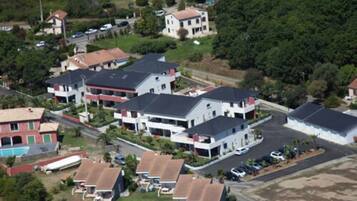 A residential area with multiple two-story houses, some with attached garages, and a few with visible balconies.