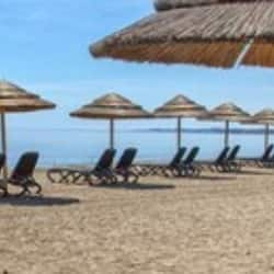 On the beach, sun loungers, beach umbrellas, beach towels