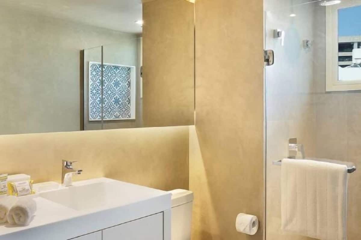 Designer toiletries, hair dryer, towels
