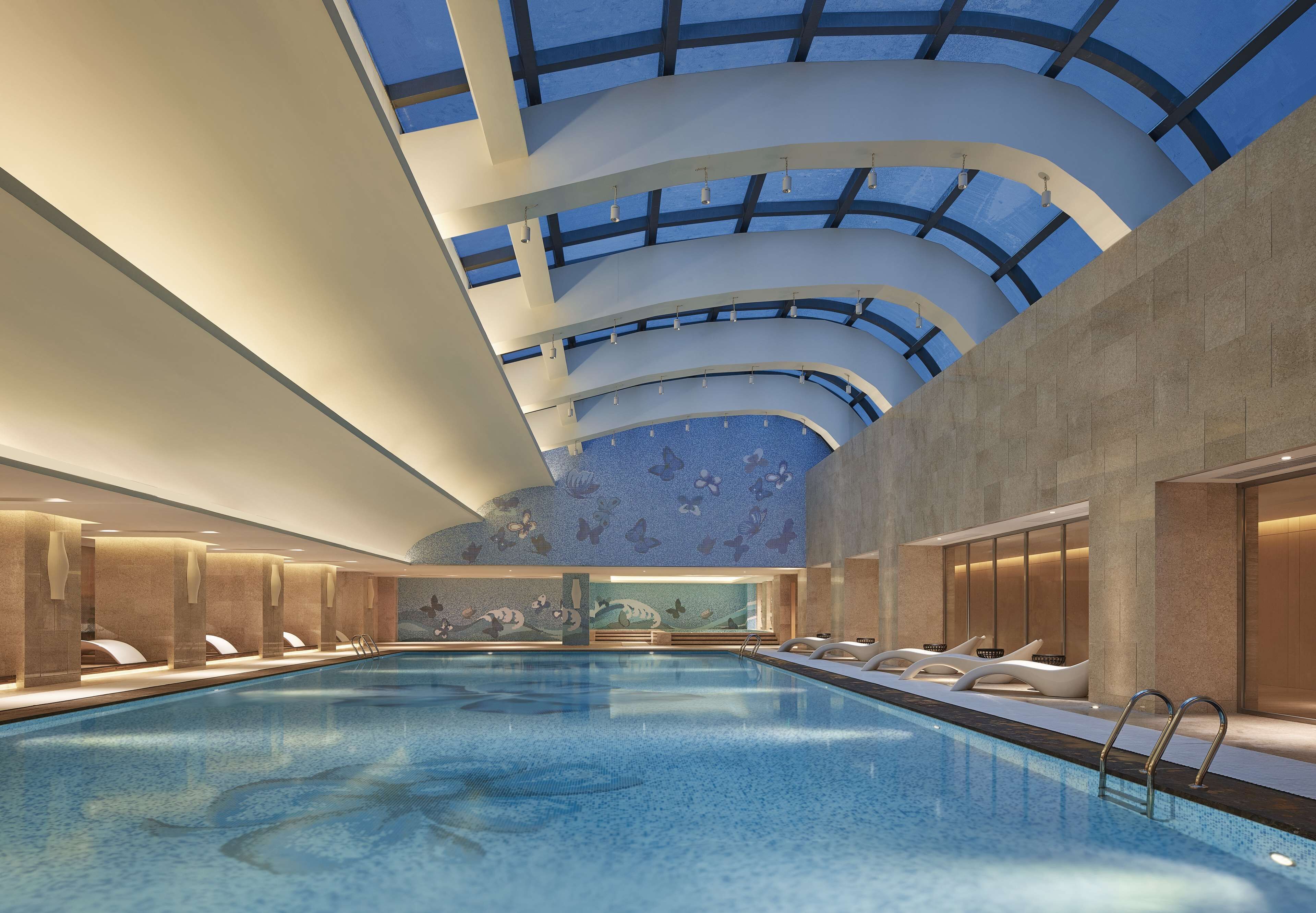 Indoor pool, pool umbrellas, pool loungers