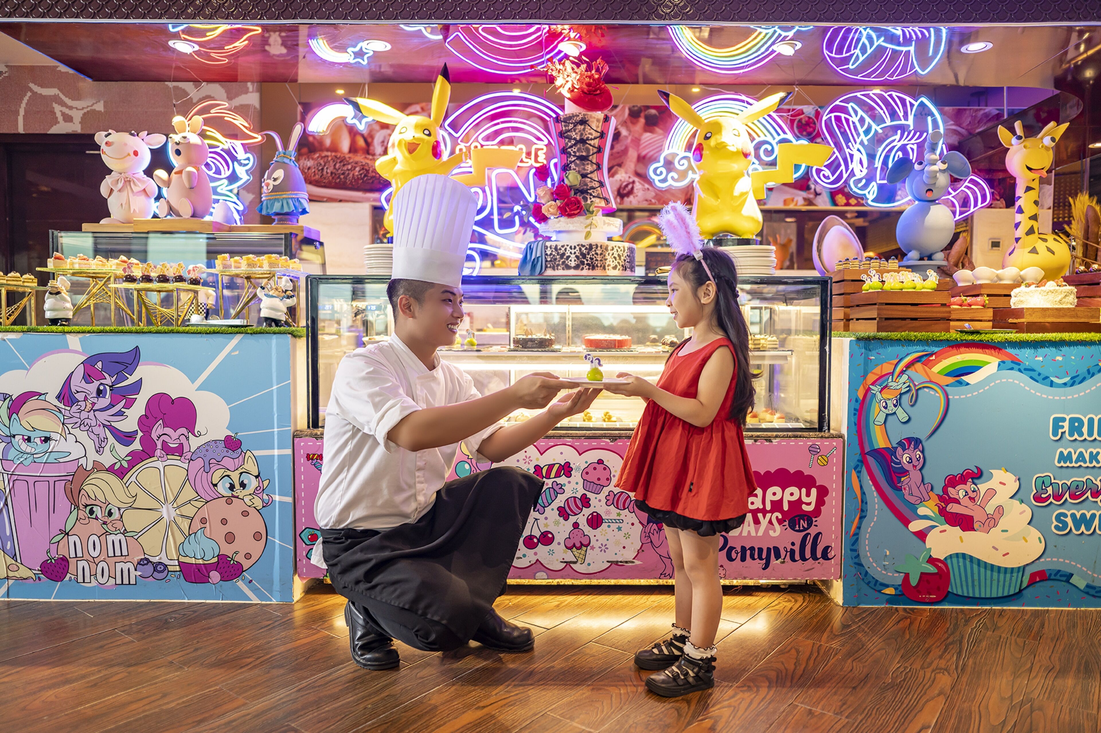 A brightly lit food stall with colorful decorations and cartoon characters.