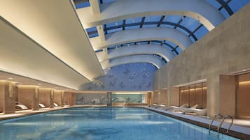 Indoor pool, pool umbrellas, pool loungers