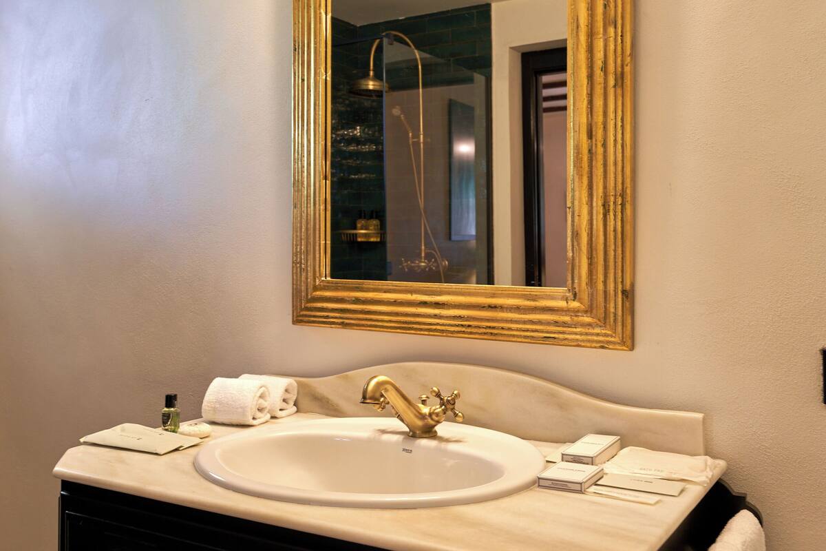 deluxe double room | bathroom | shower, rainfall showerhead, hair dryer, bathrobes