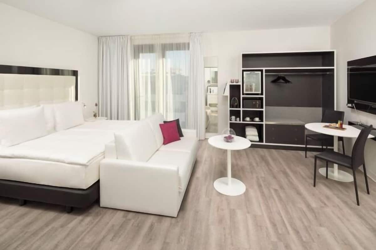 Hypo-allergenic bedding, free minibar, in-room safe, desk
