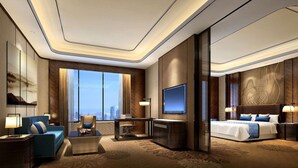 A modern hotel room with a large bed, a TV mounted on the wall, a seating area with a sofa and armchairs, and a large window offering a city view. - Wyndham Grand Plaza Royale Huayu Chongqing (Chongqing)