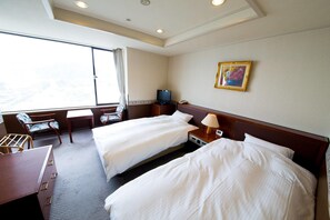A hotel room with two beds, a desk, a chair, a television, and a painting on the wall. - Naruto Grand Hotel (Naruto)
