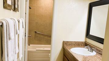 Combined shower/tub, hair dryer, towels, soap