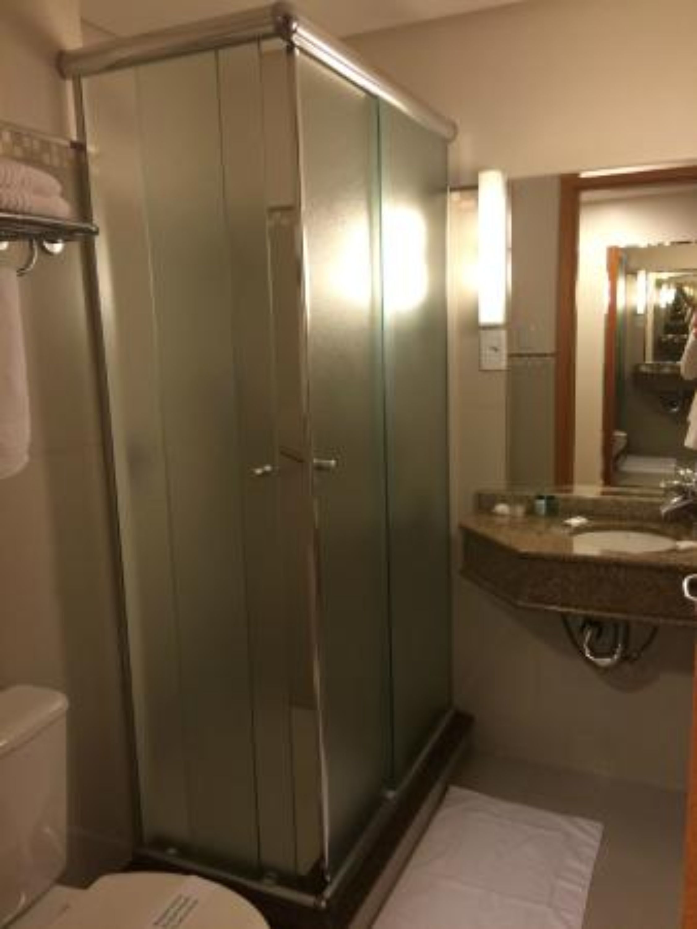 shower, rainfall showerhead, hair dryer, towels