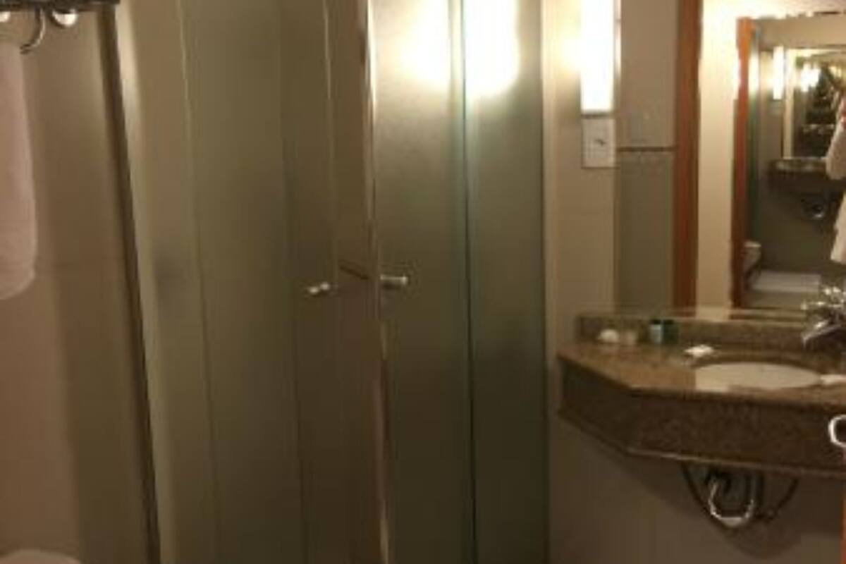 shower, rainfall showerhead, hair dryer, towels