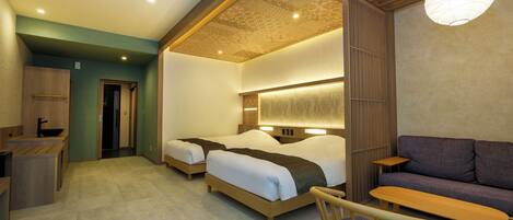 A modern hotel room with two beds, a sofa, a wooden chair, and a dining table.