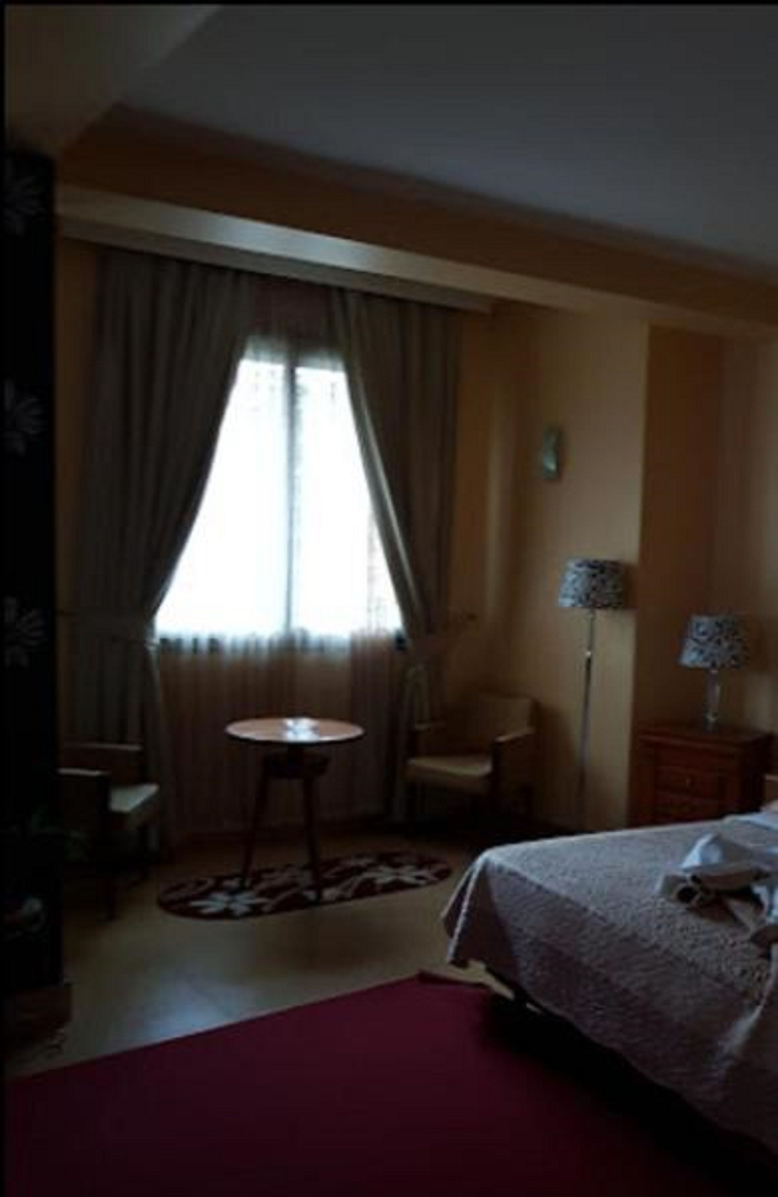 junior suite | desk, blackout curtains, iron/ironing board