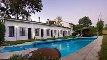 Seasonal outdoor pool, open 11:30 AM to 8:30 PM, pool loungers