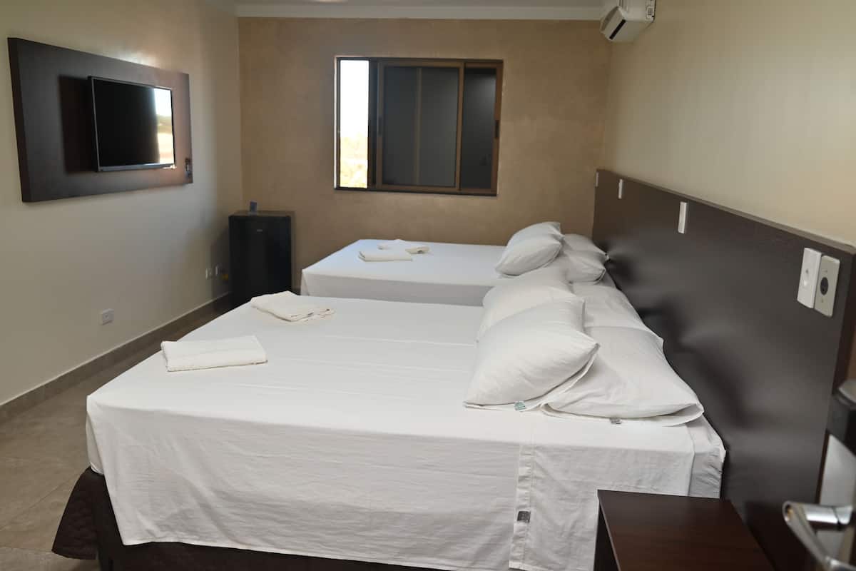 executive quadruple room | minibar, in-room safe, desk, laptop workspace