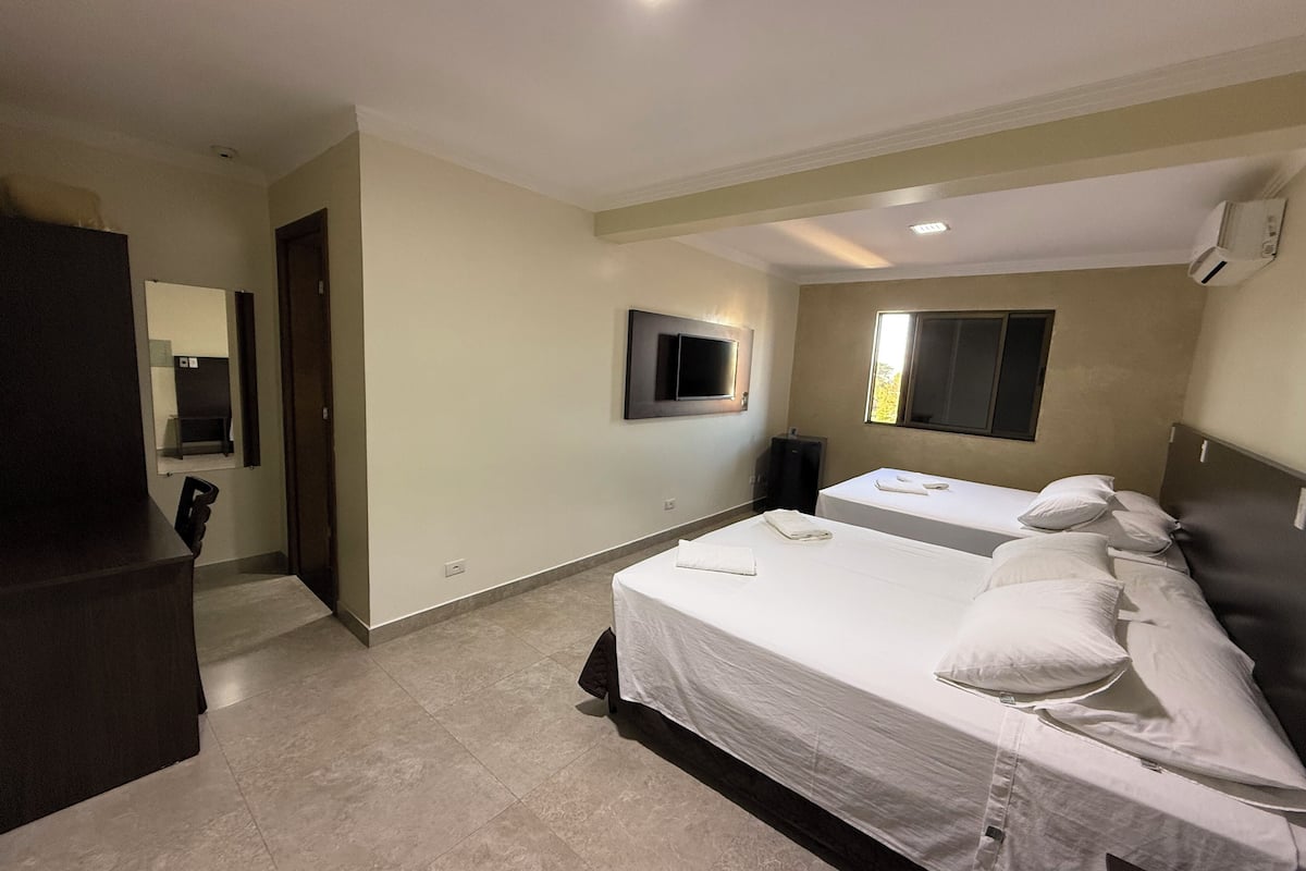 executive quadruple room | minibar, in-room safe, desk, laptop workspace