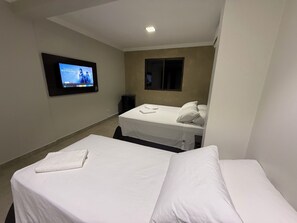 Family Triple Room | Minibar, in-room safe, desk, laptop workspace