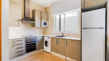 Apartment, 1 Bedroom | Private kitchen | Full-sized fridge, microwave, stovetop, coffee/tea maker