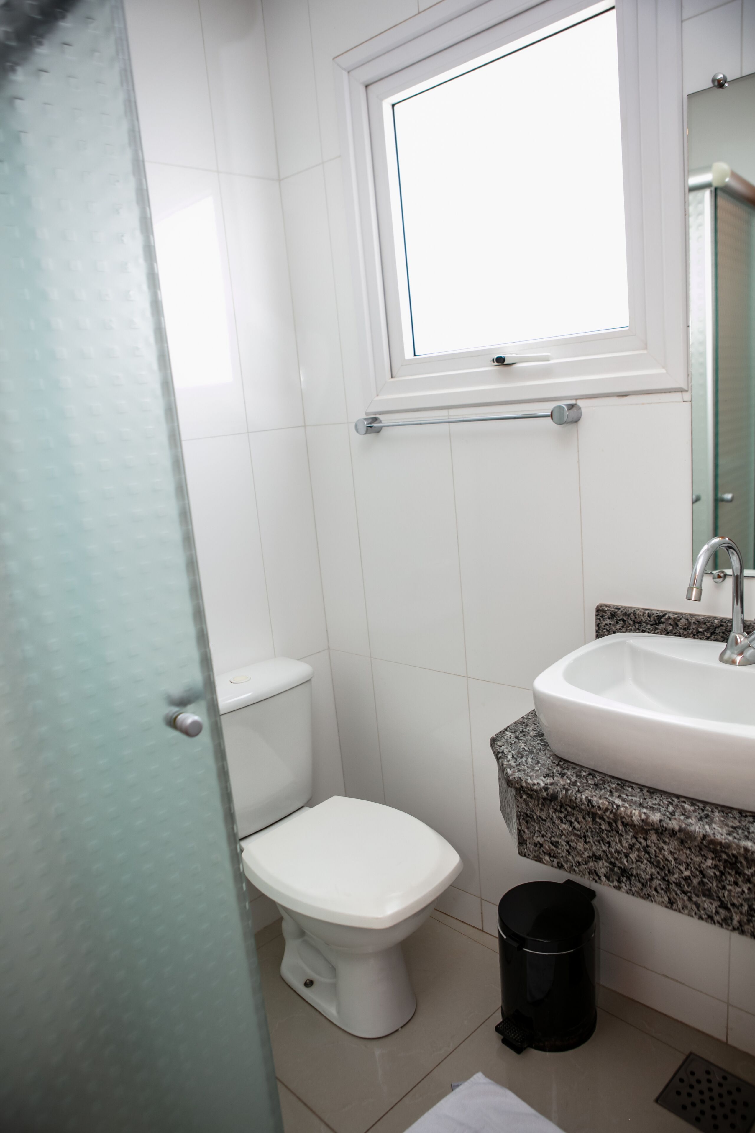 deluxe triple room | bathroom | shower, towels, soap, shampoo