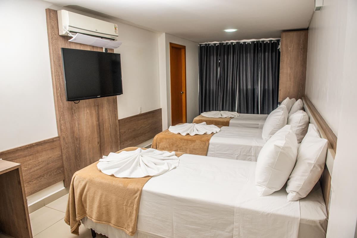 Deluxe Triple Room | 1 bedroom, minibar, individually furnished, desk