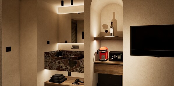 A modern bathroom with a marble sink, a coffee machine, a hairdryer, and a TV mounted on the wall. - Ano Kampos (Rhodes)