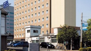 A multi-story hotel with a prominent sign on the top. - Toyoko Inn Yokohama Shinkoyasu Ekimae (Yokohama)
