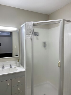 Shower, hair dryer, towels, soap