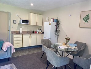 One Bedroom Family Unit | Private kitchen | Dining tables - Heritage Park Lodge (Haast)