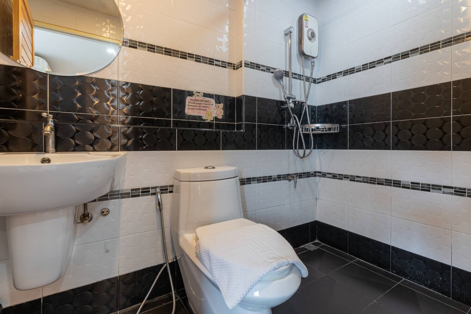 deluxe quadruple room | bathroom | shower, free toiletries, hair dryer, slippers