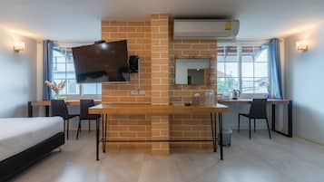 Deluxe Quadruple Room | Desk, laptop workspace, blackout drapes, soundproofing