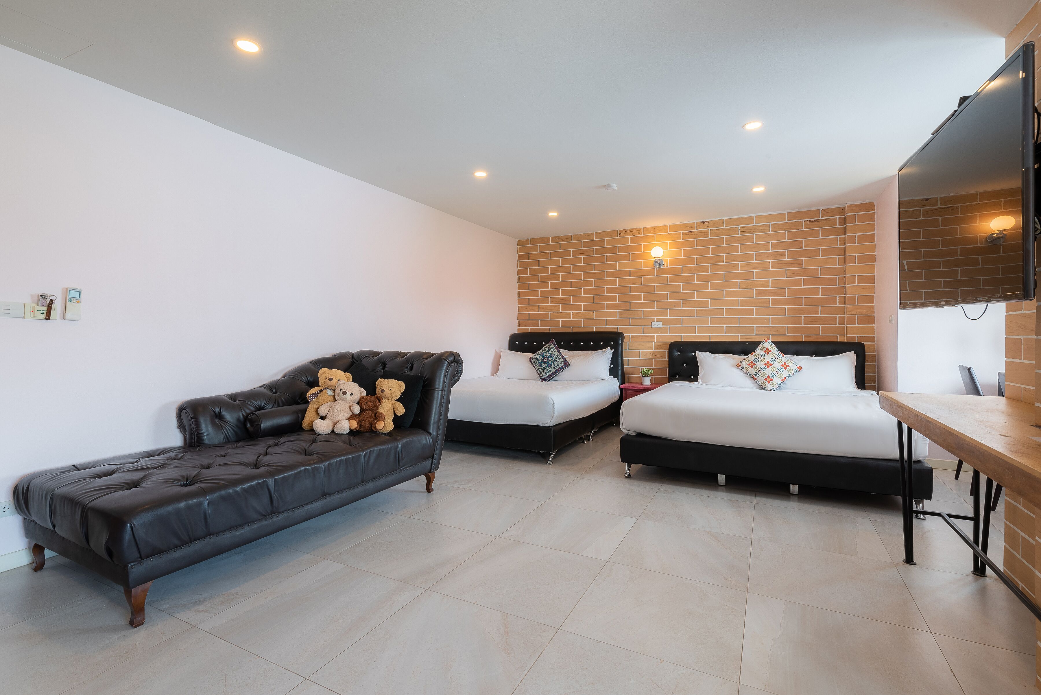 deluxe quadruple room | desk, laptop workspace, blackout curtains, soundproofing