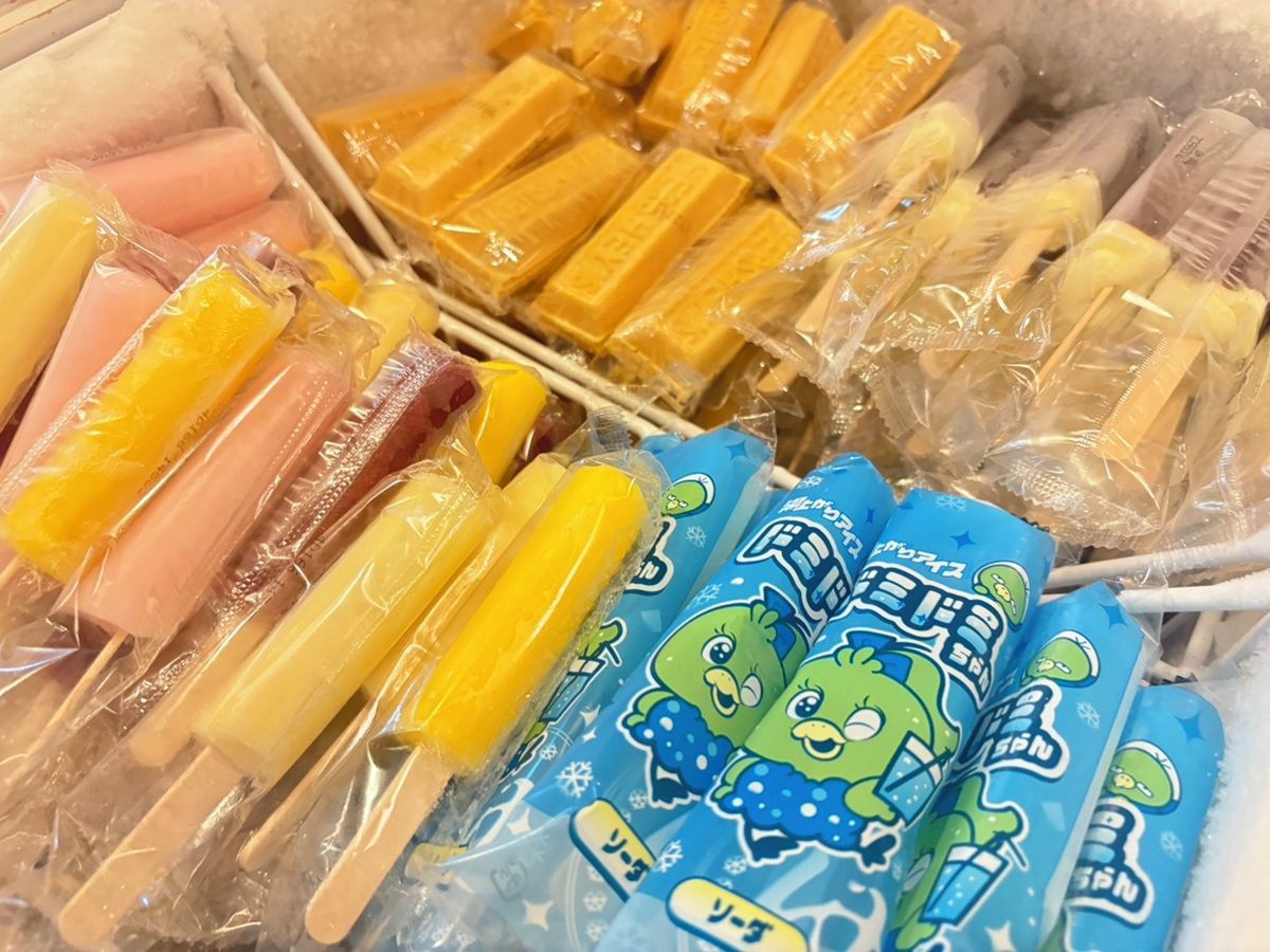A variety of packaged items, including what appears to be frozen treats and snacks, arranged in a display.