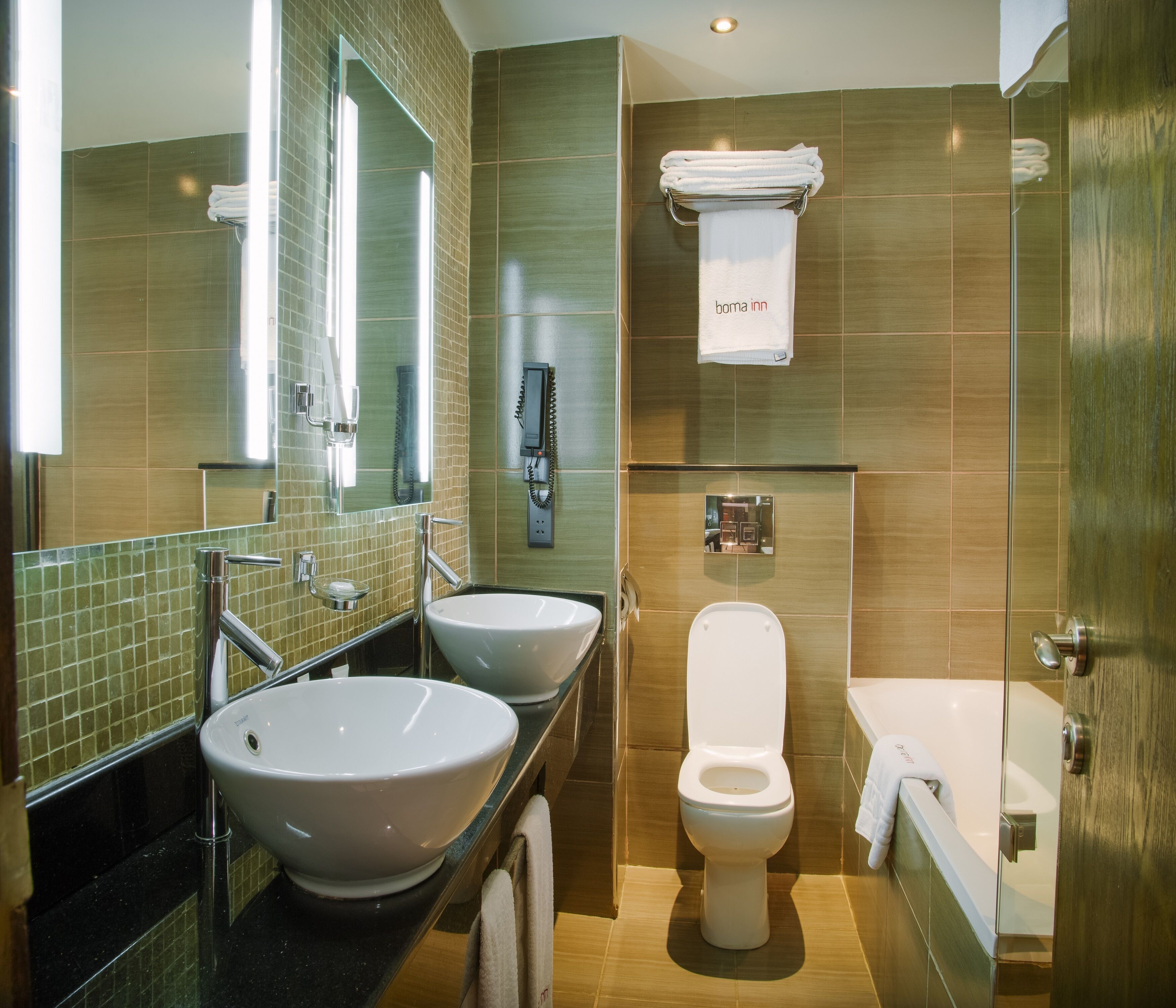 deluxe double room | bathroom | separate bathtub and shower, free toiletries, hair dryer, bathrobes