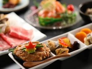 A variety of food items on a tray, including a dish with a dollop of sauce topped with a flower. - Shigakogen Hotel Ichibokaku (Yamanouchi)