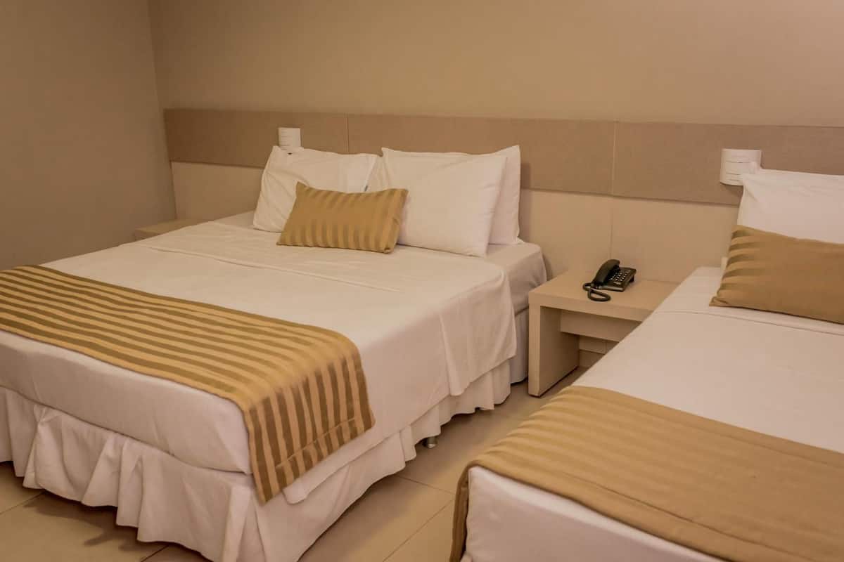 Standard Triple Room | Minibar, in-room safe, desk, blackout drapes