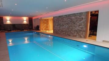 Indoor pool, open 6:30 AM to 9 PM, pool loungers