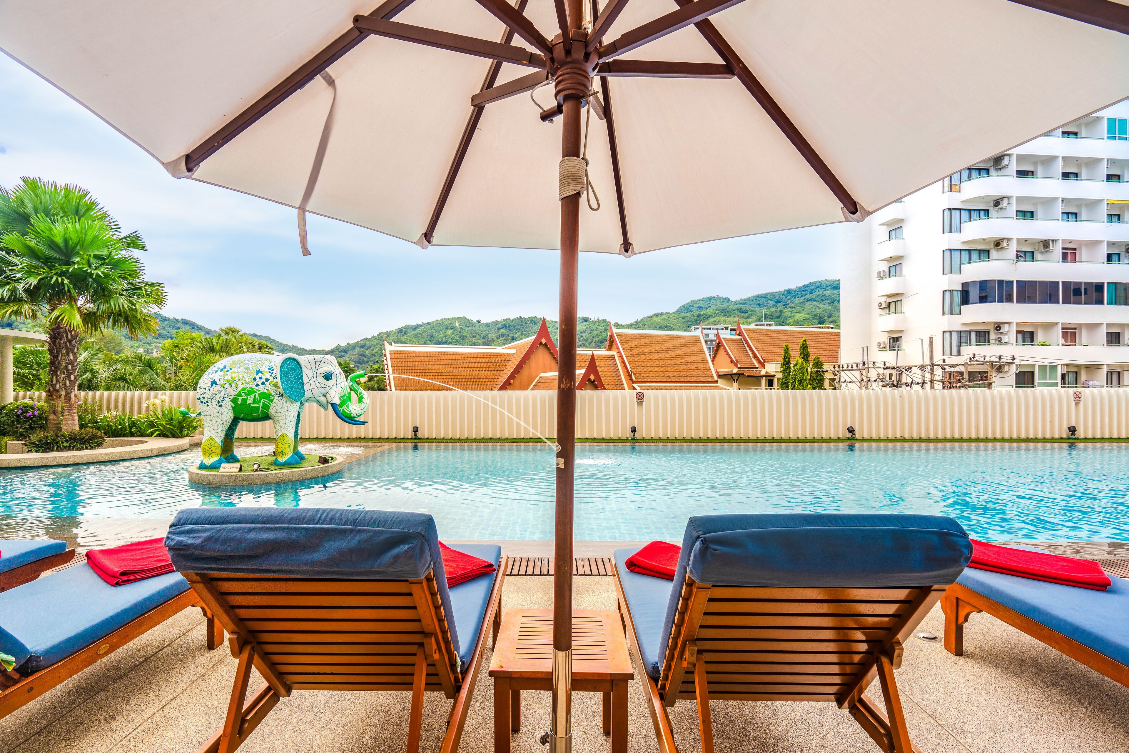 outdoor pool, pool umbrellas, pool loungers