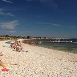 On the beach, scuba diving, waterskiing, windsurfing