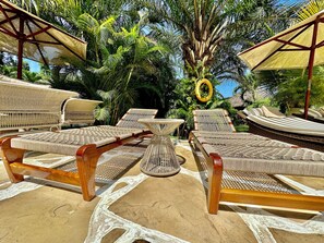 Outdoor pool, open 6:00 AM to 10:00 PM, pool umbrellas, sun loungers