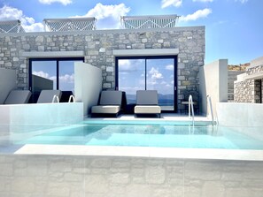 Relax by the pool with panoramic views and lounge in comfort on the outdoor furniture.