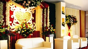 A room with a white sofa, white armchairs, and a red carpet. - Alam Permai (Bandung)