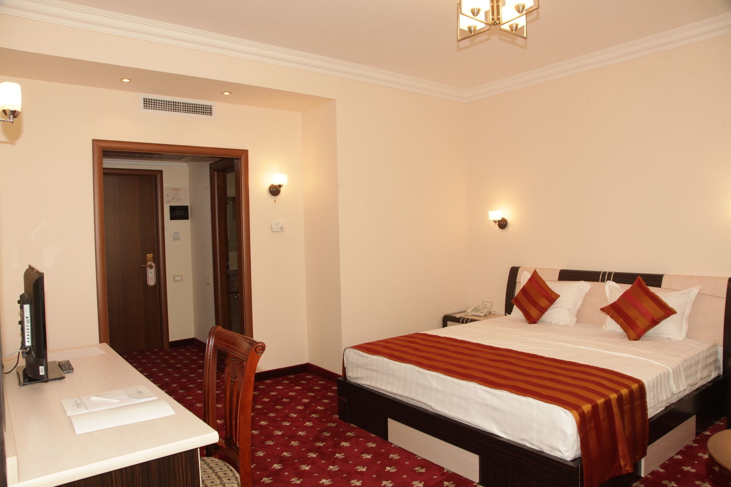 family room | premium bedding, minibar, in-room safe, desk