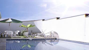 Outdoor pool, pool umbrellas, pool loungers