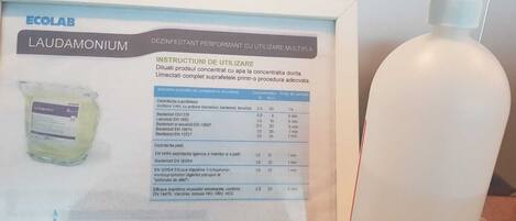 A framed product information sheet for Ecolab Laudamonium, detailing its use as a disinfectant.
