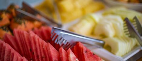 A fruit platter with watermelon, cantaloupe, and other fruits.