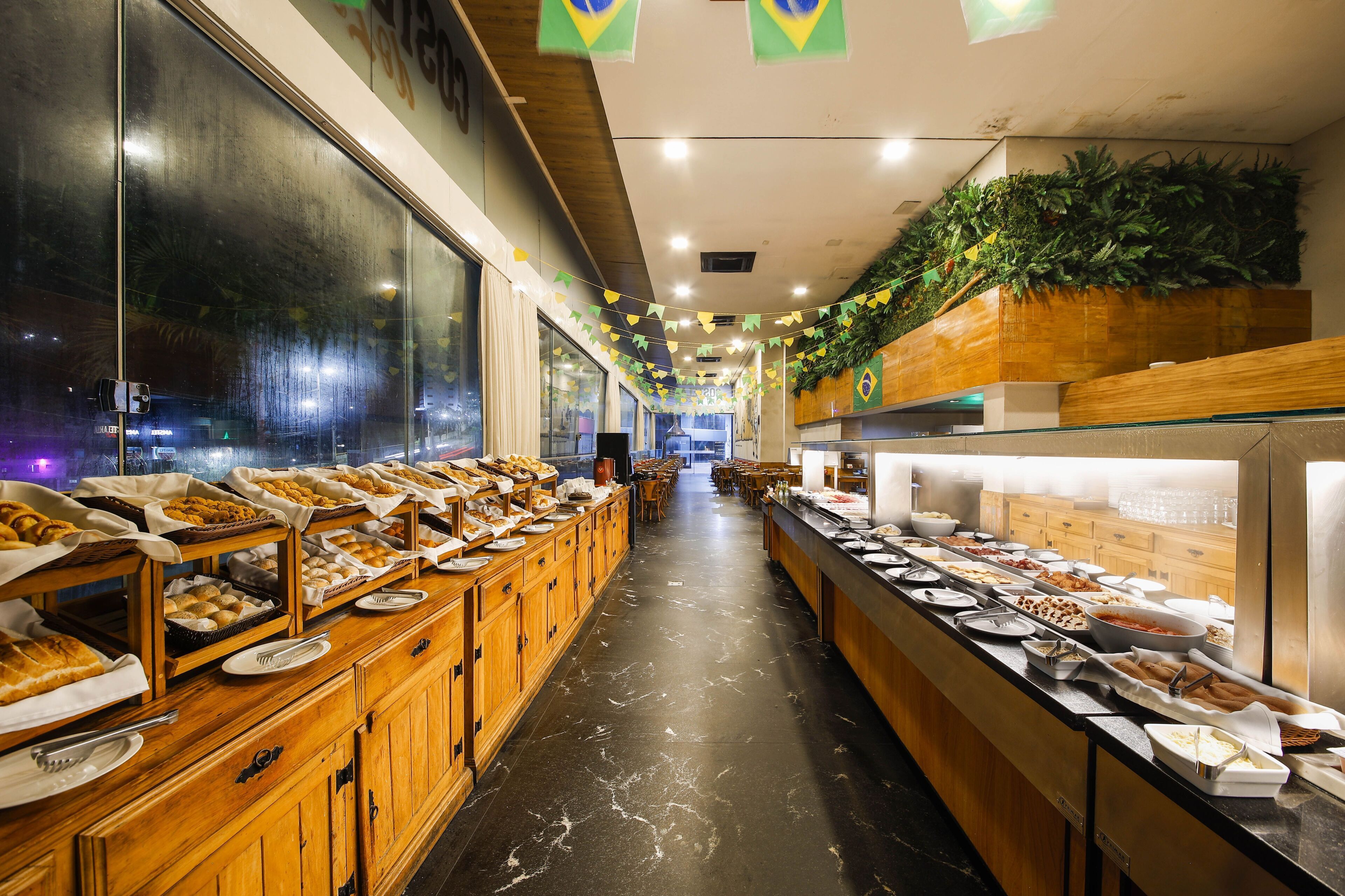 A buffet area with various food options and a long counter.