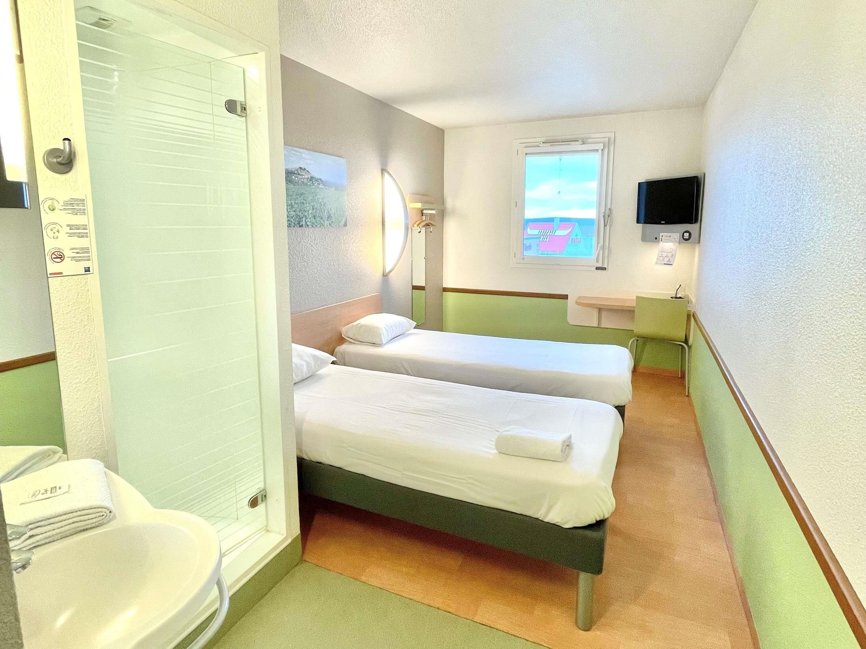 twin room, 2 single beds | desk, laptop workspace, blackout curtains, soundproofing